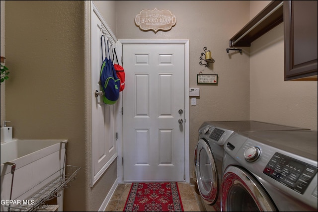 1337 Emerald Gate Ln, El Paso, TX 79936 - washroom featuring washer and clothes dryer and cabinet space