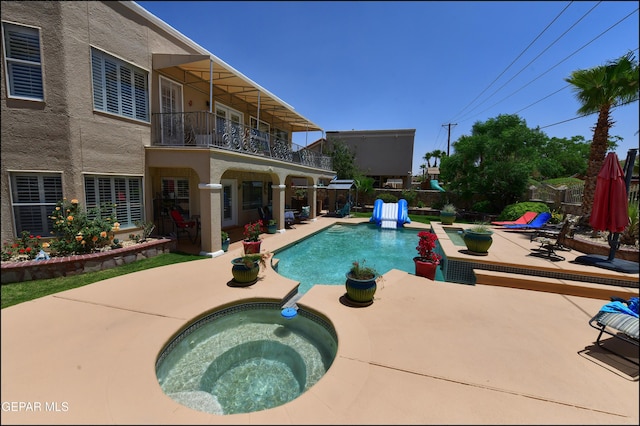 1337 Emerald Gate Ln, El Paso, TX 79936 - view of swimming pool with an in-ground hot tub and a patio area