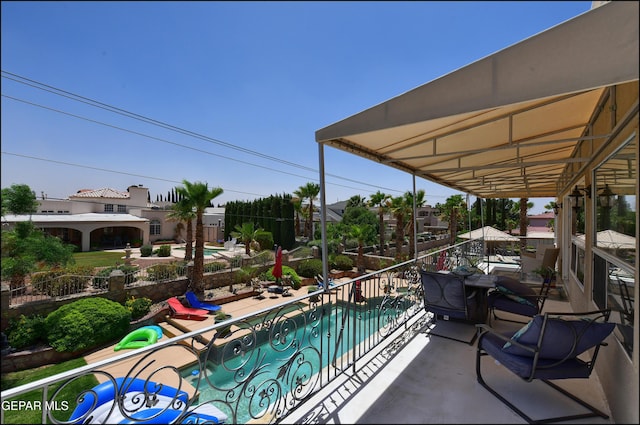 1337 Emerald Gate Ln, El Paso, TX 79936 - balcony featuring view of pool area and a patio area