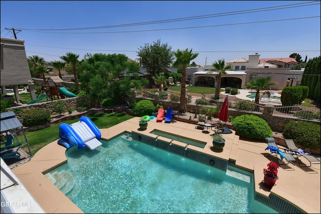 1337 Emerald Gate Ln, El Paso, TX 79936 - view of swimming pool featuring a playground and a patio