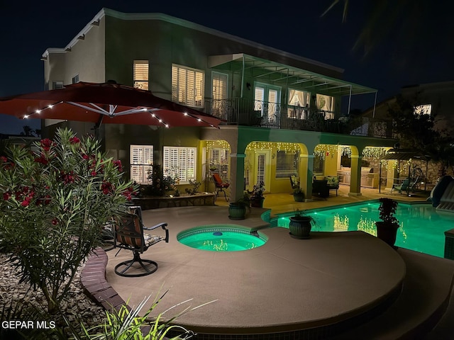1337 Emerald Gate Ln, El Paso, TX 79936 - pool at twilight with a patio area, an in-ground hot tub, and an outdoor pool