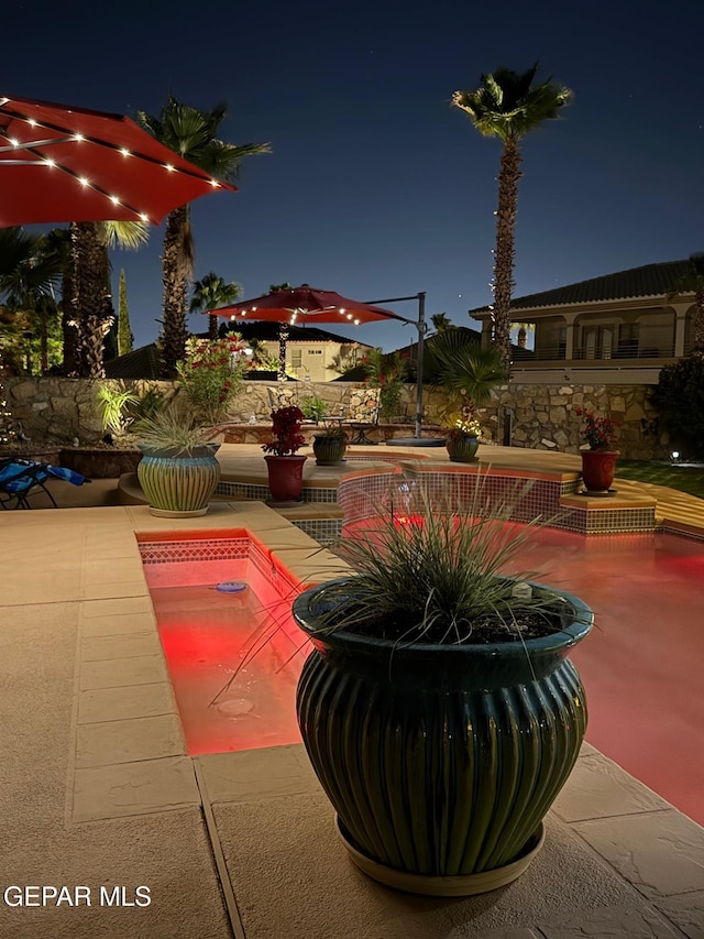 1337 Emerald Gate Ln, El Paso, TX 79936 - patio at night featuring a patio