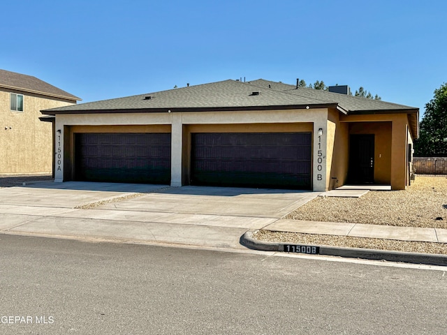 11500 Summer Dr Unit A & B, Socorro, TX 79927 - view of front of home with an attached garage, concrete driveway, stucco siding, and a shingled roof