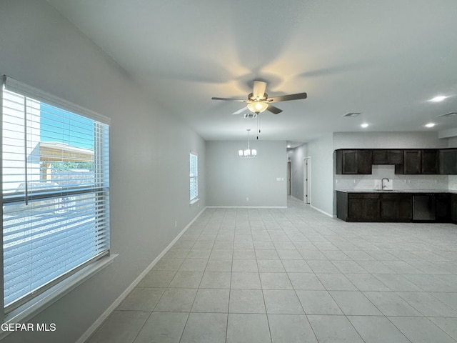 11500 Summer Dr Unit A & B, Socorro, TX 79927 - unfurnished living room with plenty of natural light, a ceiling fan, baseboards, light tile patterned floors, and recessed lighting
