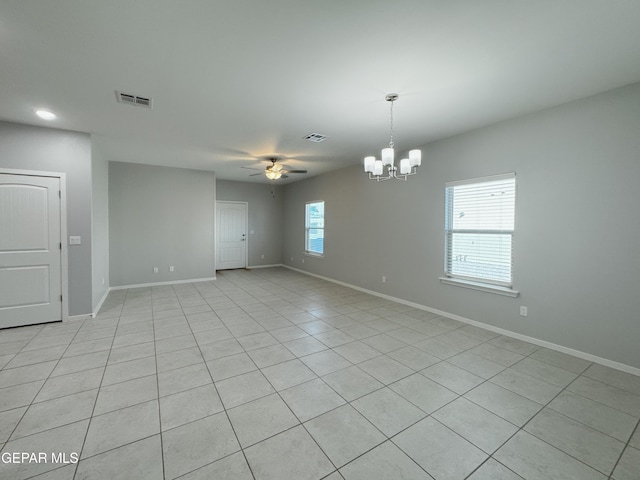 11500 Summer Dr Unit A & B, Socorro, TX 79927 - spare room with a ceiling fan, a chandelier, light tile patterned floors, and baseboards