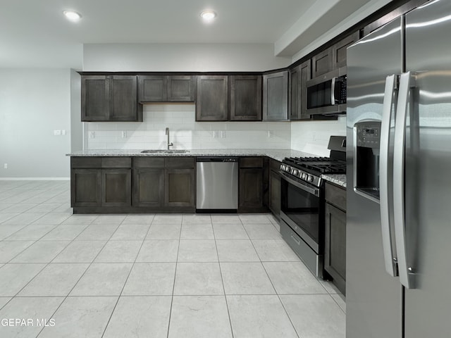 11500 Summer Dr Unit A & B, Socorro, TX 79927 - kitchen with stainless steel appliances, a sink, light stone countertops, dark brown cabinetry, and recessed lighting