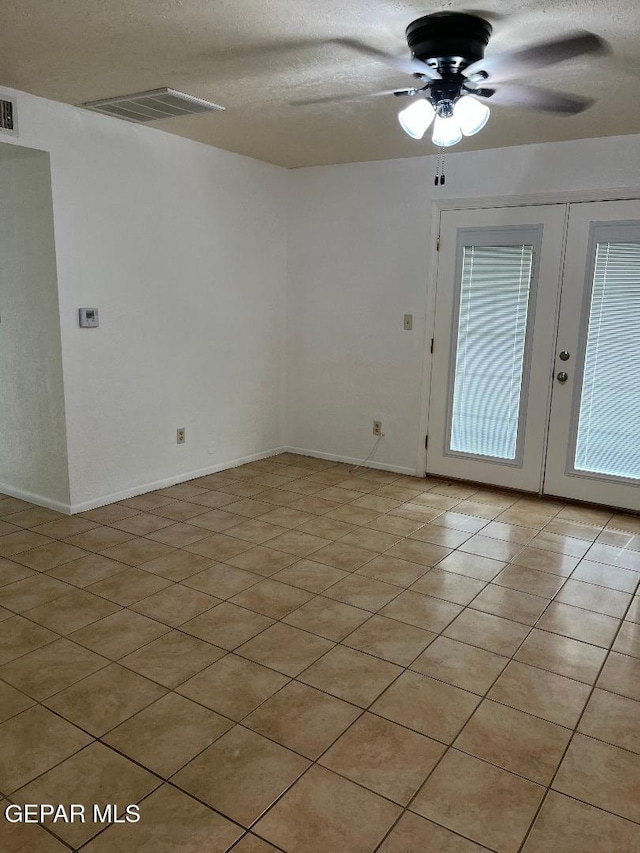 1017 Ralpheene St, El Paso, TX 79907 - unfurnished room with ceiling fan, a textured ceiling, french doors, baseboards, and light tile patterned flooring