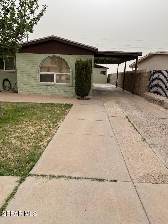1017 Ralpheene St, El Paso, TX 79907 - view of front of house featuring driveway and a carport