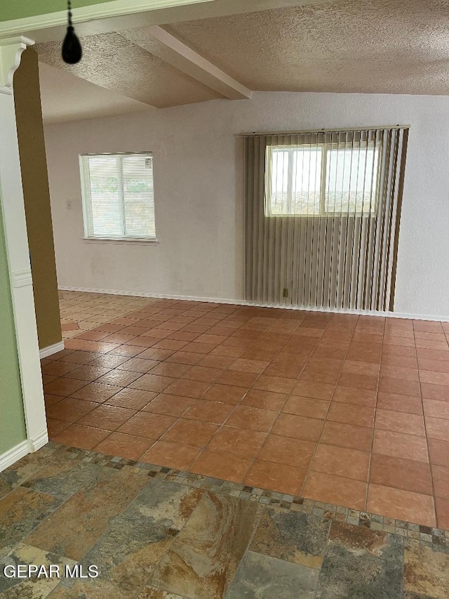 1017 Ralpheene St, El Paso, TX 79907 - empty room featuring a textured ceiling and baseboards