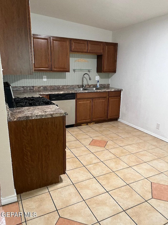 1017 Ralpheene St, El Paso, TX 79907 - kitchen with dishwasher, a sink, baseboards, light tile patterned floors, and black range with gas cooktop