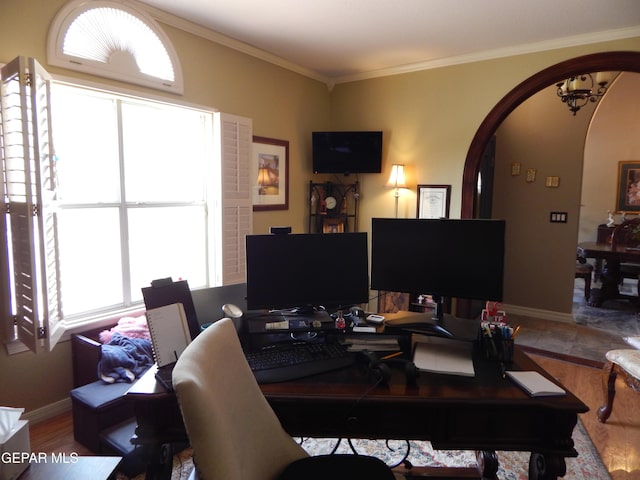 7012 Diamond Ridge Dr, El Paso, TX 79912 - office with arched walkways, baseboards, ornamental molding, and wood finished floors