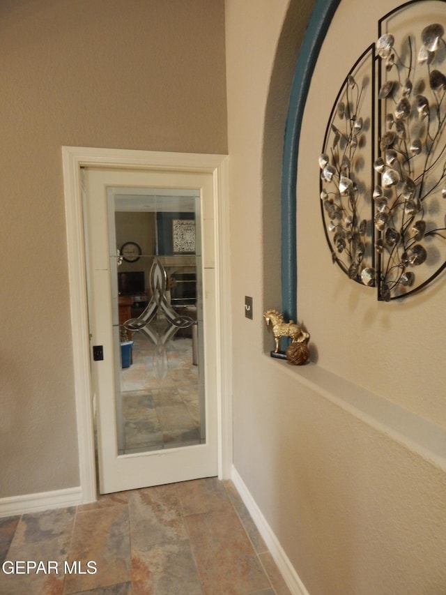 7012 Diamond Ridge Dr, El Paso, TX 79912 - interior space featuring baseboards and stone finish floors