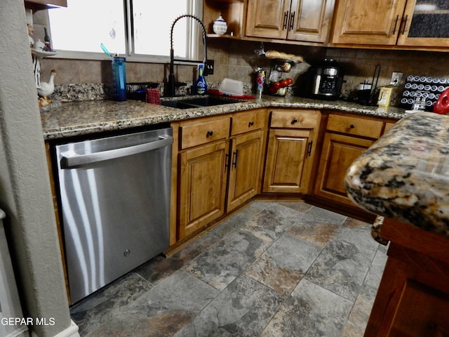 7012 Diamond Ridge Dr, El Paso, TX 79912 - kitchen with stainless steel dishwasher, a sink, stone tile floors, and decorative backsplash