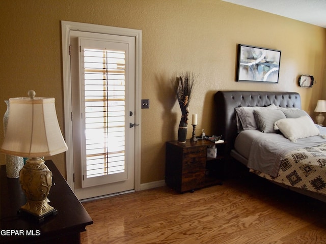 7012 Diamond Ridge Dr, El Paso, TX 79912 - bedroom with wood finished floors and baseboards