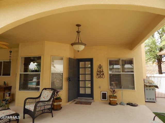 7012 Diamond Ridge Dr, El Paso, TX 79912 - entrance to property with stucco siding and a patio area