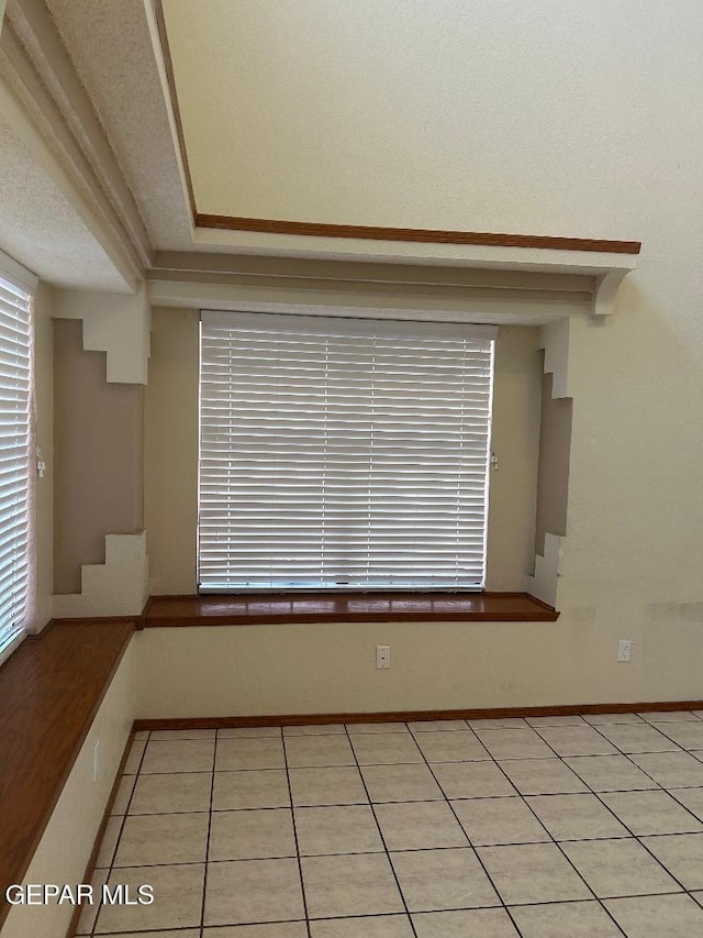 12014 El Greco Cir, El Paso, TX 79936 - empty room featuring light tile patterned flooring and baseboards