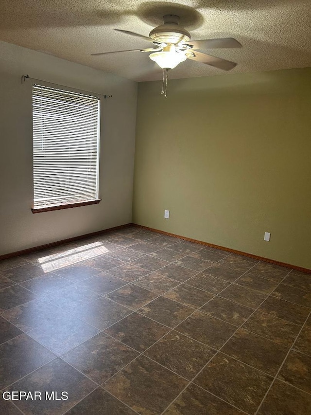 12014 El Greco Cir, El Paso, TX 79936 - unfurnished room with a ceiling fan, a textured ceiling, and baseboards