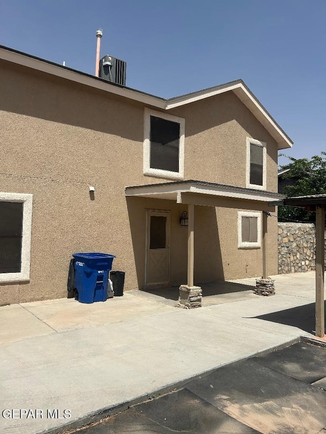 12014 El Greco Cir, El Paso, TX 79936 - rear view of house with stucco siding and a patio area