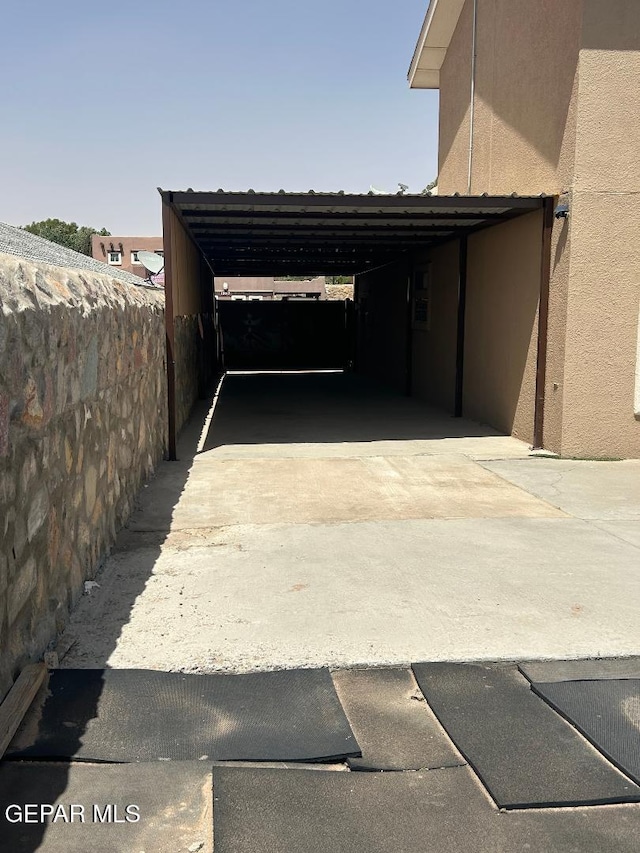 12014 El Greco Cir, El Paso, TX 79936 - view of parking featuring driveway and an attached carport