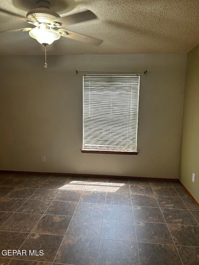 12014 El Greco Cir, El Paso, TX 79936 - spare room featuring a ceiling fan, a textured ceiling, and baseboards