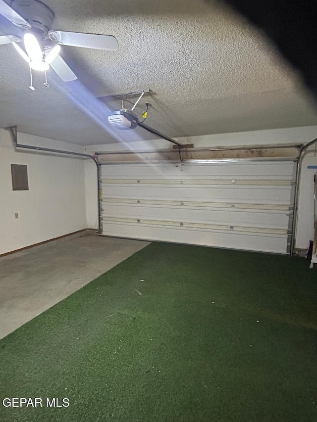 12014 El Greco Cir, El Paso, TX 79936 - garage featuring a garage door opener and ceiling fan