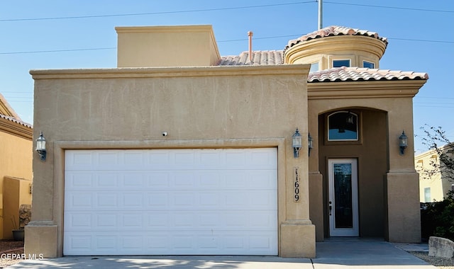 11609 Saint Thomas Way, El Paso, TX 79936 - view of front of property featuring stucco siding, a tile roof, driveway, and a garage