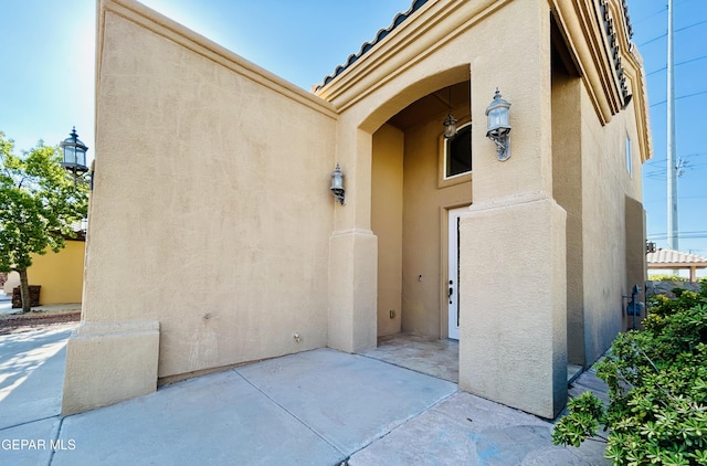11609 Saint Thomas Way, El Paso, TX 79936 - property entrance featuring stucco siding and a patio area