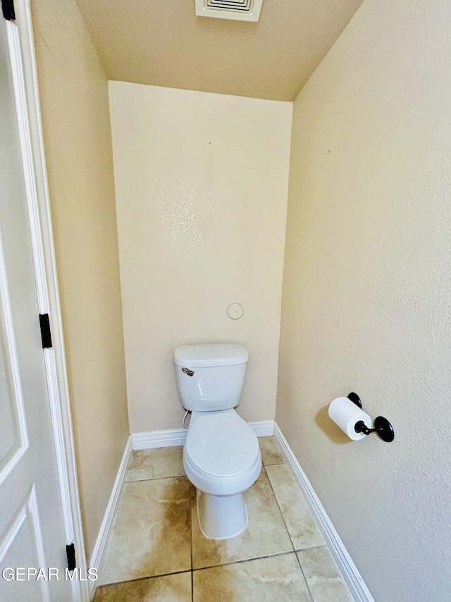 11609 Saint Thomas Way, El Paso, TX 79936 - bathroom with toilet, tile patterned floors, and baseboards