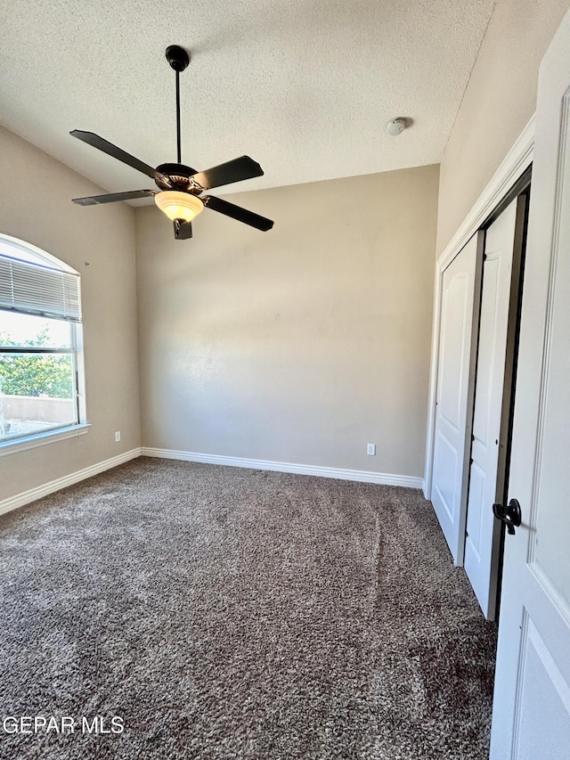 11609 Saint Thomas Way, El Paso, TX 79936 - unfurnished room with a textured ceiling, carpet, ceiling fan, and baseboards