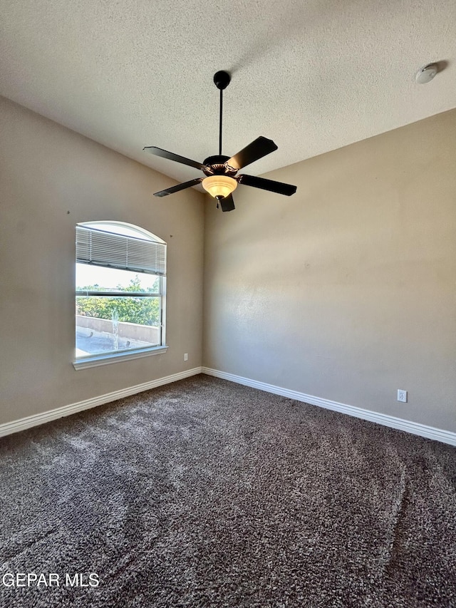 11609 Saint Thomas Way, El Paso, TX 79936 - spare room with baseboards, carpet floors, ceiling fan, and a textured ceiling