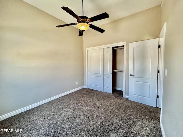 11609 Saint Thomas Way, El Paso, TX 79936 - unfurnished bedroom with dark carpet, baseboards, a closet, vaulted ceiling, and ceiling fan