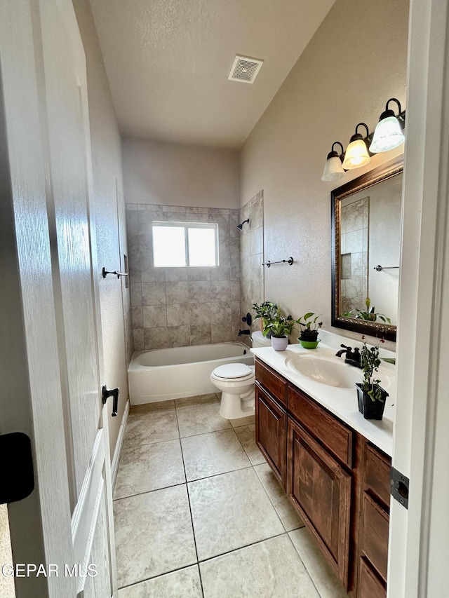 11609 Saint Thomas Way, El Paso, TX 79936 - bathroom featuring vanity, toilet, tile patterned floors, and bathing tub / shower combination