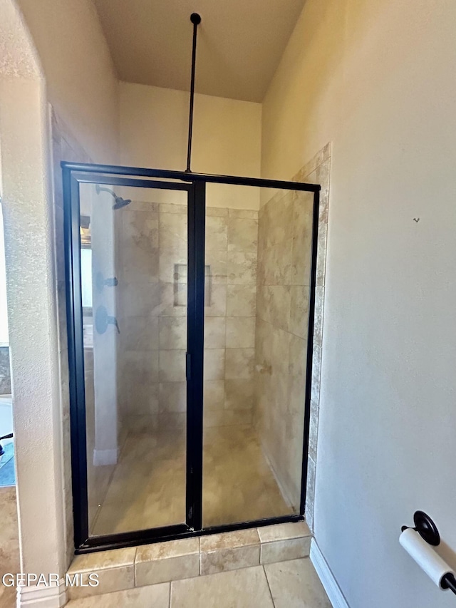 11609 Saint Thomas Way, El Paso, TX 79936 - bathroom featuring a stall shower and tile patterned flooring