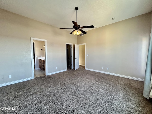 11609 Saint Thomas Way, El Paso, TX 79936 - unfurnished bedroom featuring carpet, baseboards, connected bathroom, and a ceiling fan