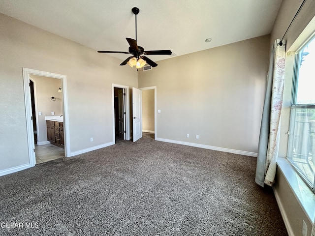 11609 Saint Thomas Way, El Paso, TX 79936 - unfurnished bedroom with carpet flooring, baseboards, ensuite bath, and ceiling fan