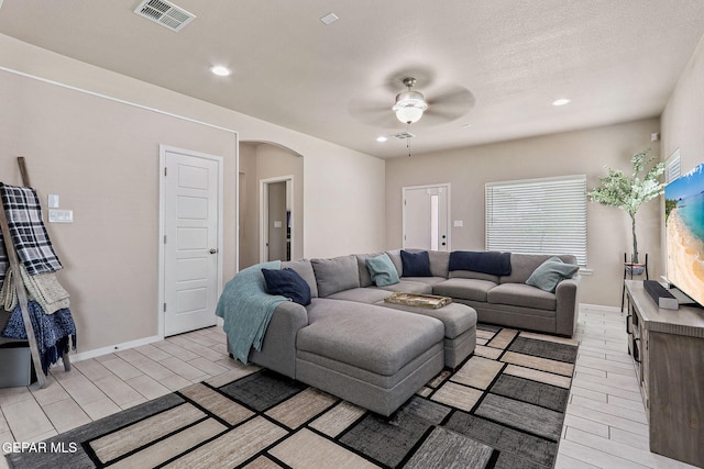 4817 Mark Avizo, El Paso, TX 79938 - living area featuring arched walkways, ceiling fan, recessed lighting, and baseboards
