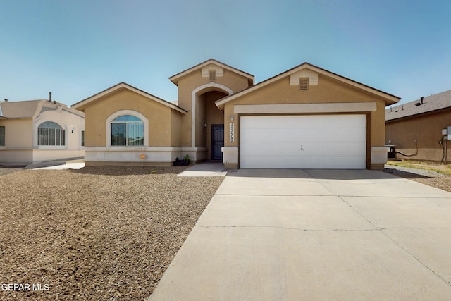 12009 Copper Point Pl, El Paso, TX 79934 - view of front of house featuring stucco siding, concrete driveway, and an attached garage