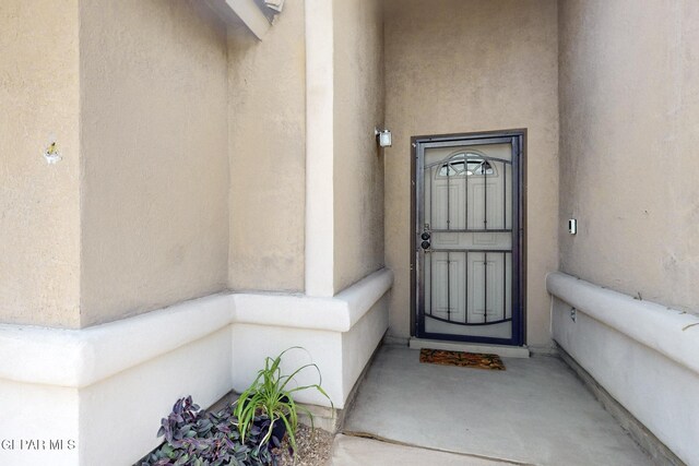 12009 Copper Point Pl, El Paso, TX 79934 - doorway to property featuring stucco siding