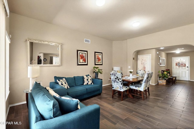 12009 Copper Point Pl, El Paso, TX 79934 - living room with arched walkways, wood finished floors, and baseboards