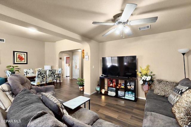 12009 Copper Point Pl, El Paso, TX 79934 - living area featuring arched walkways, a ceiling fan, wood finished floors, and baseboards