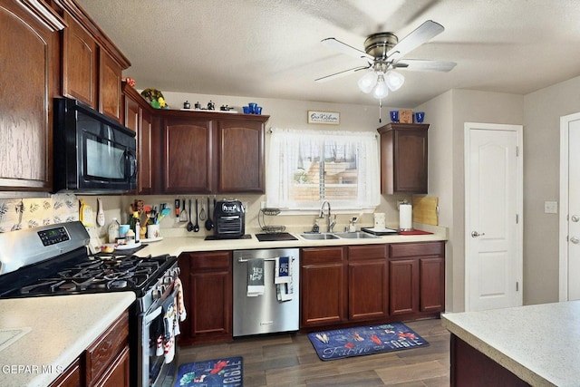12009 Copper Point Pl, El Paso, TX 79934 - kitchen with stainless steel appliances, a sink, dark wood-type flooring, a ceiling fan, and light countertops