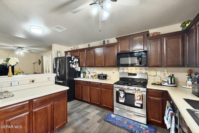 12009 Copper Point Pl, El Paso, TX 79934 - kitchen featuring black appliances, ceiling fan, light countertops, dark wood-style floors, and dark brown cabinetry