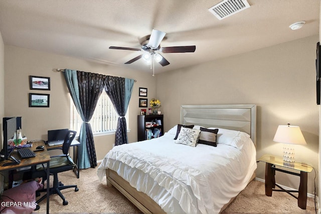 12009 Copper Point Pl, El Paso, TX 79934 - carpeted bedroom with baseboards, a desk, and a ceiling fan