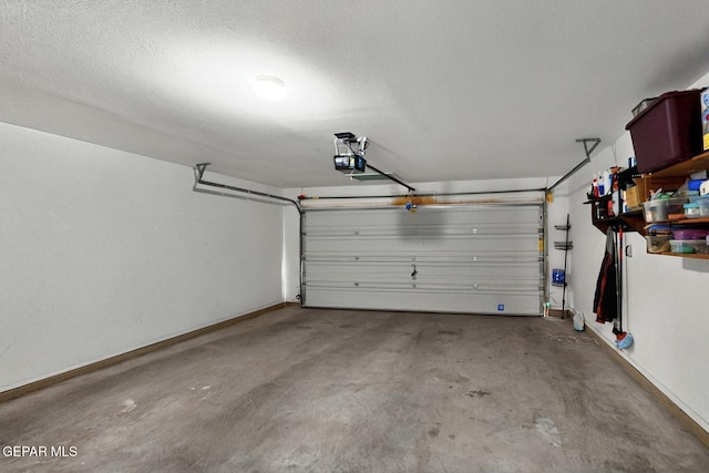 12009 Copper Point Pl, El Paso, TX 79934 - garage featuring baseboards and a garage door opener