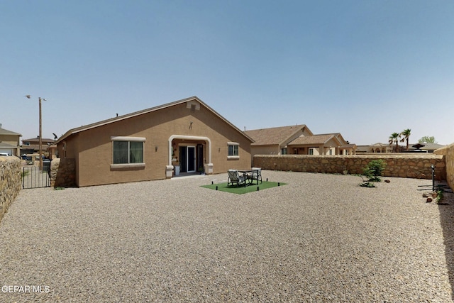 12009 Copper Point Pl, El Paso, TX 79934 - back of house with a fenced backyard and stucco siding