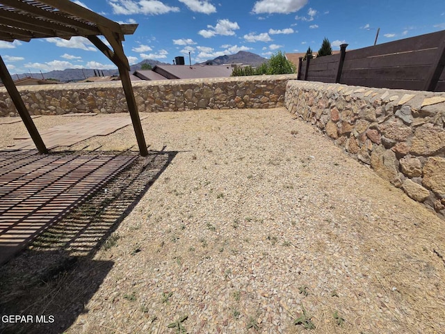 PPP10049 Paloma Dr, El Paso, TX 79924 - fenced backyard featuring a pergola, a patio, and a mountain view