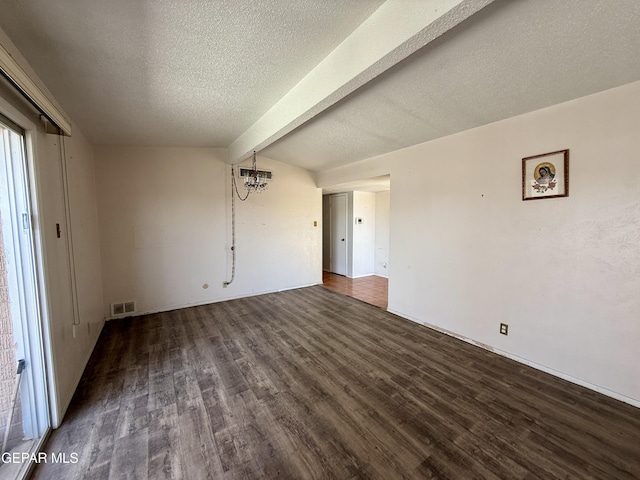 3216 Drumond Rd, El Paso, TX 79925 - unfurnished living room with wood finished floors, beamed ceiling, a chandelier, and a textured ceiling