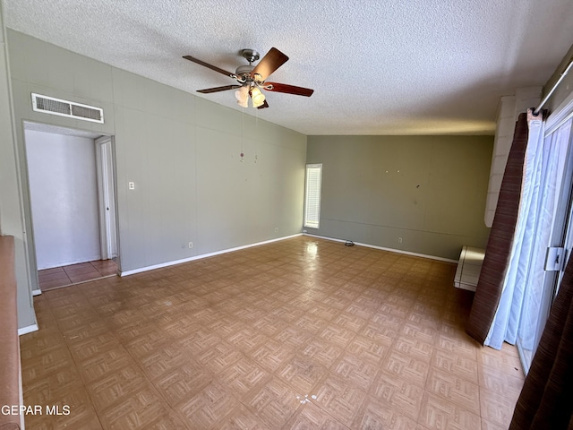 3216 Drumond Rd, El Paso, TX 79925 - spare room with ceiling fan, a textured ceiling, and baseboards