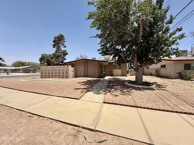 3216 Drumond Rd, El Paso, TX 79925 - view of front facade featuring a garage and driveway