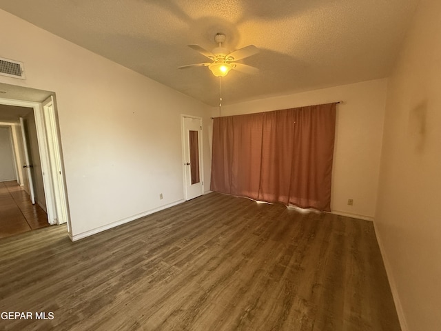 3216 Drumond Rd, El Paso, TX 79925 - unfurnished room with wood finished floors, a ceiling fan, a textured ceiling, and baseboards